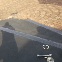 Seams were repaired on this low slope roof with EPDM flashing tape and sealant